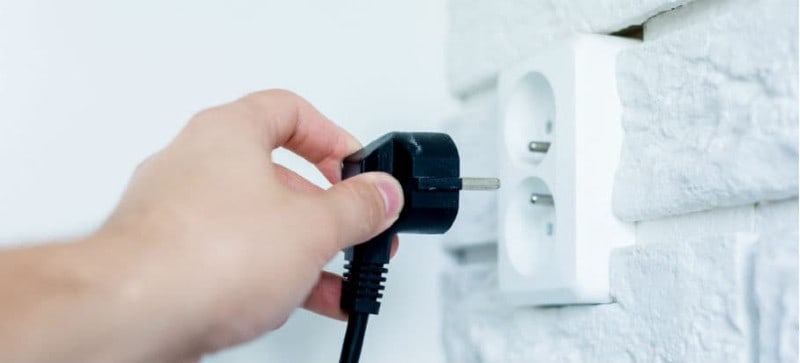 unplug the wire from the power outlet